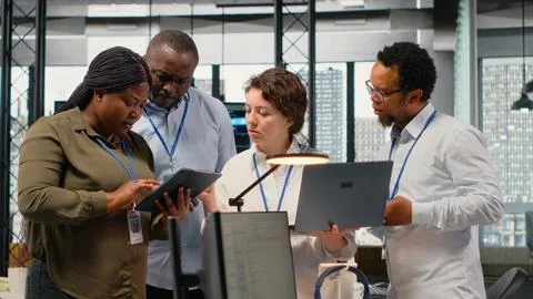 Engineering team working together in office, using AI specialized hardware Stock Photos