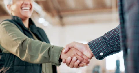 Engineering, teamwork or carpenter shaking hands in workshop for a manufacturing Stock Footage 263408780