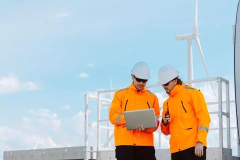 Engineering teamwork outdoor, Wind farm survey, Power generator renewable t.. Stock Photos