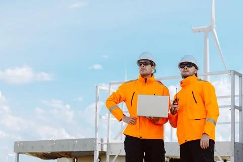 Engineering teamwork outdoor, Wind farm survey, Power generator renewable t.. Stock Photos