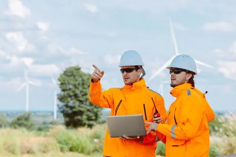 Engineering teamwork outdoor, Wind farm survey, Power generator renewable t.. Stock Photos