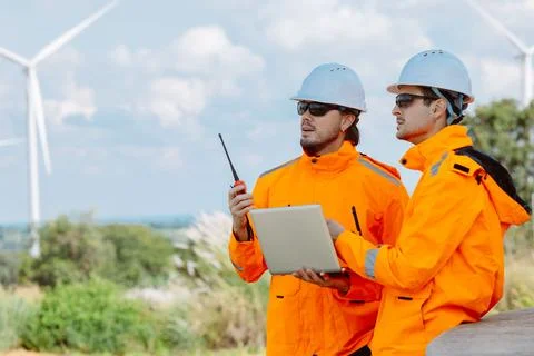 Engineering teamwork outdoor, Wind farm survey, Power generator renewable t.. Stock Photos