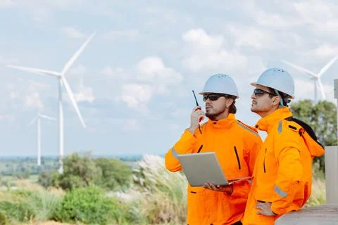 Engineering teamwork outdoor, Wind farm survey, Power generator renewable t.. Stock Photos
