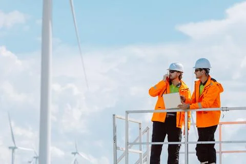 Engineering teamwork outdoor, Wind farm survey, Power generator renewable t.. Stock Photos