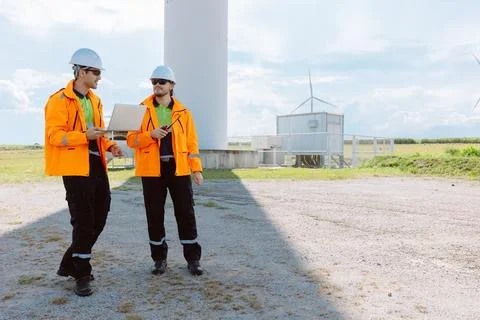 Engineering teamwork outdoor, Wind farm survey, Power generator renewable t.. Stock Photos
