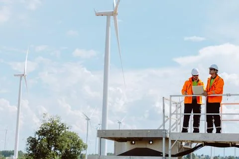 Engineering teamwork outdoor, Wind farm survey, Power generator renewable t.. Stock Photos