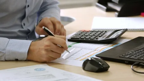 Engineering-technical worker. Office worker studying business papers. HD Stock Footage 72319273