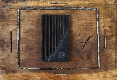 Engineering tools drill on wooden table. Success concept Stock Photos