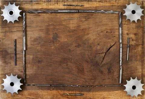 Engineering tools gears and drill on wooden table. Stock Photos