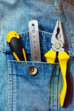 Engineering tools in jeans jacket pocket Stock Photos
