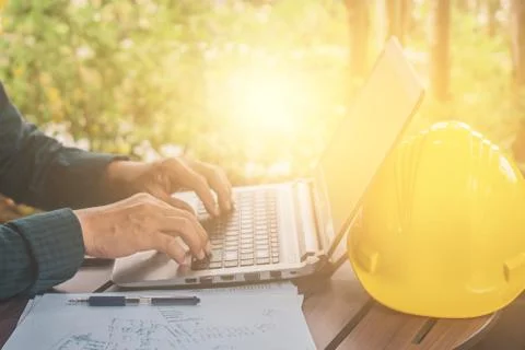 Engineering using computer working check building construction by internet te Stock Photos