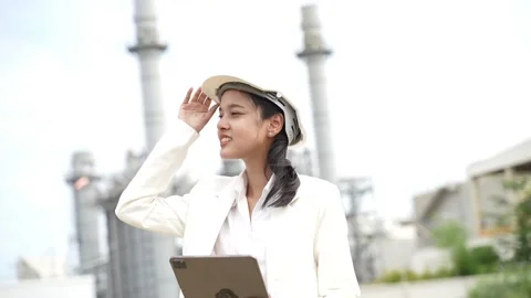 Engineering using digital tablet for working on construction site of the power p Stock Footage 279505245