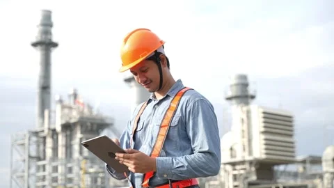 Engineering using digital tablet for working on construction site of the power p Stock Footage 279505286