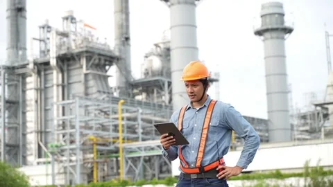 Engineering using digital tablet for working on construction site of the power p Stock Footage 279505325