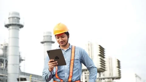 Engineering using digital tablet for working on construction site of the power p Stock Footage 279505351