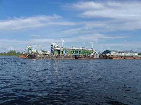 Engineering vessel to deepen the fairway, on a deep river, accompanied by per Stock Photos
