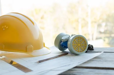 Engineering workplace, drawings, protective construction helmet and dust re.. Stock-Fotos
