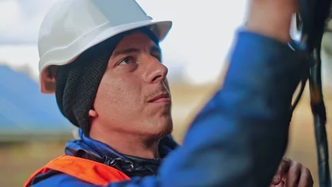 Engineering works. Mechanic in hard hat working outdoors. Stock Footage 134793385