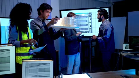 Engineers analyzing architectural building model Stockbeeldmateriaal 340455380
