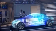 Engineers Analyzing Futuristic Holographic Car Through A Digital Screen. Stock Footage