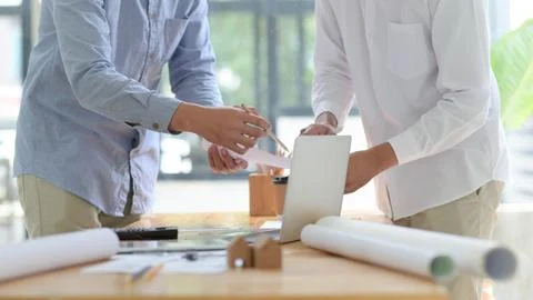 Engineers and architects are helping to design the construction. Stock Photos
