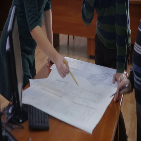 Engineers and architects discussing the blueprint at bright office Video stock 69337380