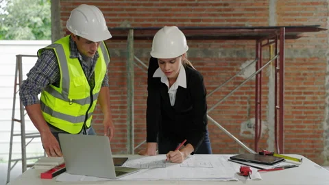 Engineers and architects discussing construction plans Stock Footage 231000888