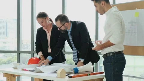 Engineers and architects work on planning, building layout, office blueprints Stock Footage 153647531