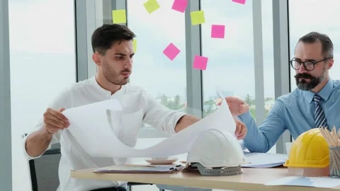 Engineers and architects work on planning, measuring, building patterns, blue Stock Footage 153663446