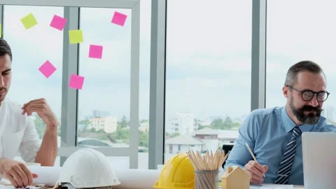 Engineers and architects work on planning, measuring, building patterns, blue Stock Footage 153664359