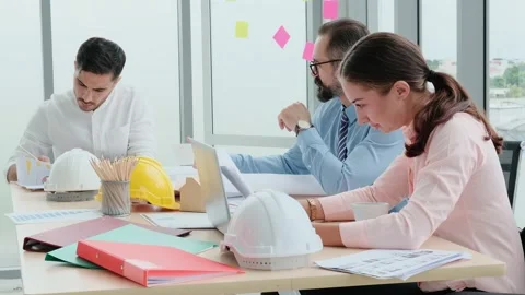 Engineers and architects work on planning, measuring, building patterns, blue Stock Footage 153667405