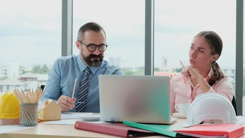 Engineers and architects work on planning, measuring, building patterns, blue Stock Footage 153668006