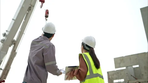 Engineers and architecture inspect and supervise the construction Stock Footage 309941333