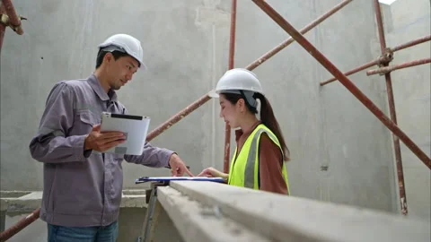 Engineers and architecture inspect and supervise the construction Stock Footage 309948330
