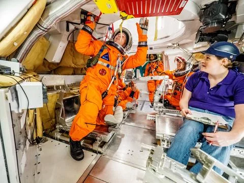 Engineers and astronauts conduct testing in a representative model Stock Photos