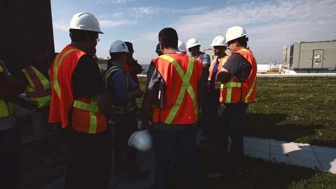 Engineers and Construction Workers Working on Green Environmental Roof Stockbeeldmateriaal 70459055