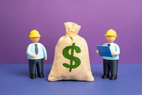 Engineers and a dollar bill. Project budget. Financial planning supports engi Stock Photos