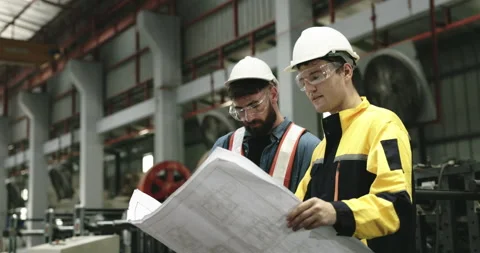 Engineers and technicians are overseeing mechanical maintenance project Stock Footage 254540916