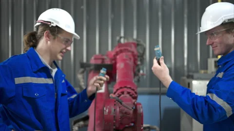 Engineers and technicians working together in a robotic arm factory, Stock Footage 262759736