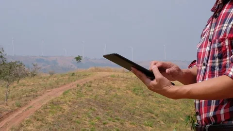 Engineers and wind turbines Stock Footage 124779072