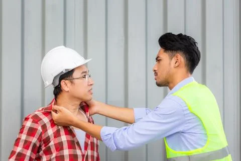 Engineers and workers are fighting at construction site. teamwork concept 스톡 사진