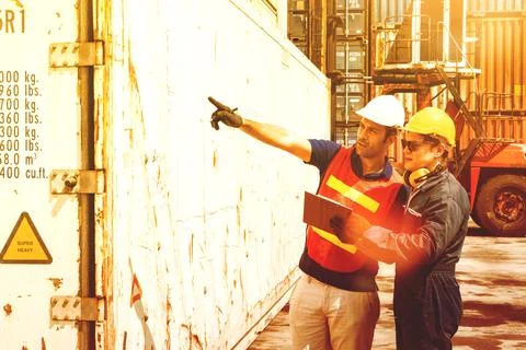 Engineers and workers check the order of container Stock Photos