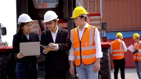 Engineers and workers using tablet laptop device and meeting. Stock Footage 154974743
