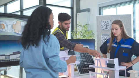 Engineers, architects, and designers collaborate to design a building Stock Footage 274534135