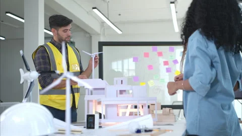 Engineers, architects, and designers collaborate to design a building Stock Footage 274704711