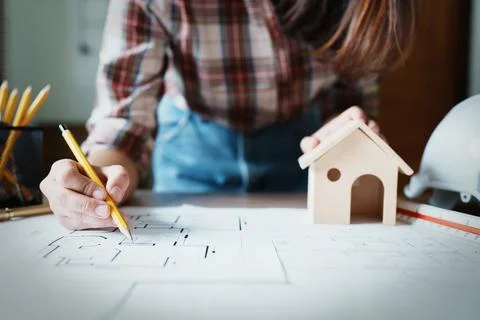 Engineers are designing house structures and architectural using blueprints Stock Photos