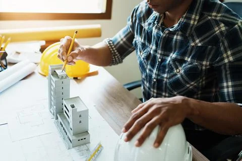 Engineers are designing house structures and architectural using blueprints Stock Photos
