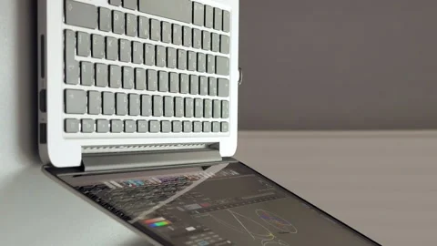 Engineers are discussing of graphs on one laptop Stock Footage 91181213