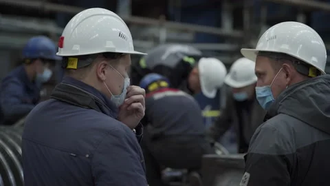 The Engineers are discussing. Operators are working together on a large turbine Stock Footage 164911619