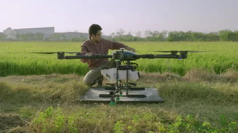 Engineers are inspecting Agricultural drones are taking off to spray medicine Stock Footage 152625570